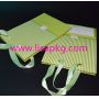 Ribbon handle green paper gift bags 