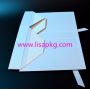 White ribbon handle folding box with black logo