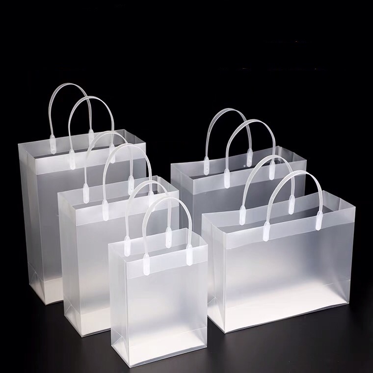 MOQ 100pcs custom pvc plastic packaging bags shopping with handle 