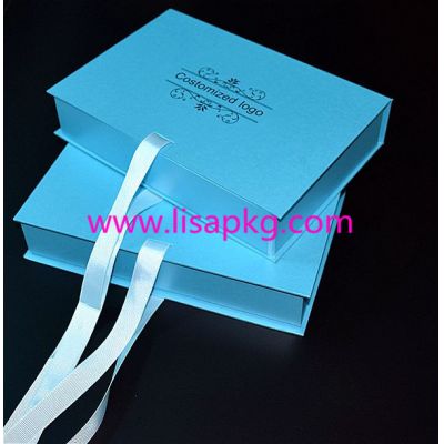 Big blue gift boxes packaging with ribbon close